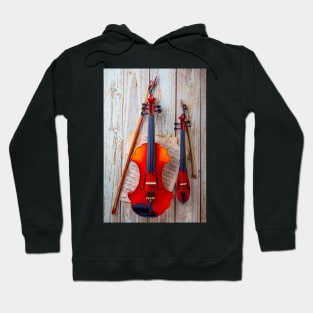 Pocket Violin With Baroque Hanging On Wooden Wall Hoodie